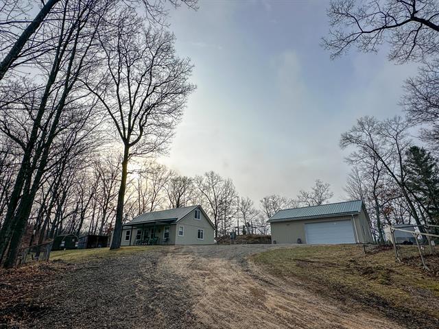 front view picture of 4020 W 9 Mile, Irons, MI. 49644