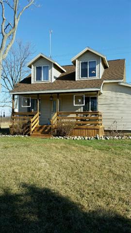 front view picture of 6272 Belding Road, Belding, MI. 48809