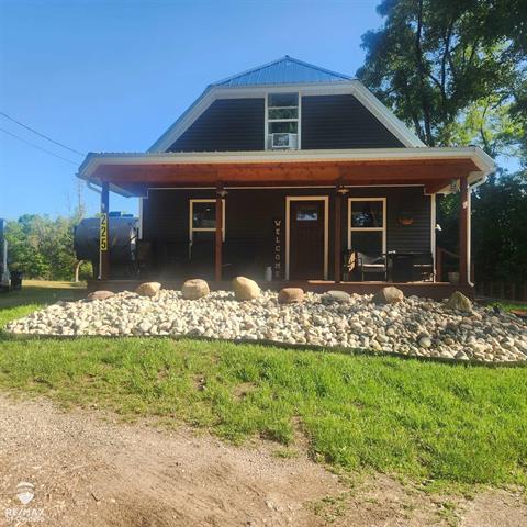 front view picture of 225 N Center Street, Six Lakes, MI. 48886