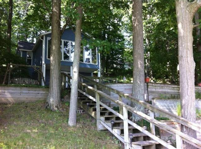 front view picture of 191 Midway Walk, Six Lakes, MI. 48886