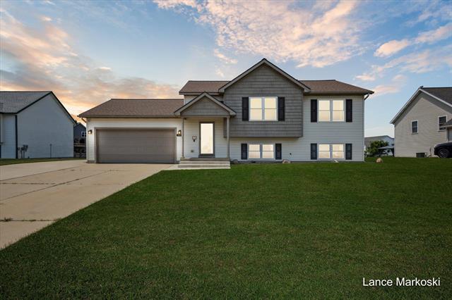 front view picture of 7039 Hartmanse  Drive, Caledonia, MI. 49316