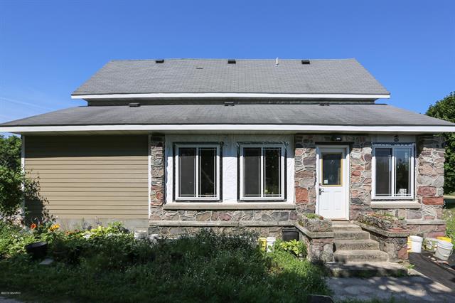 front view picture of 13607 6 Mile Road, Stanwood, MI. 49346