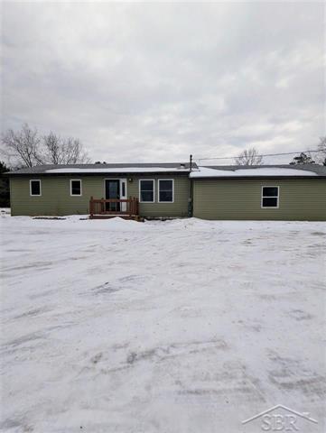 front view picture of 21229 13 Mile Rd, Leroy, MI. 49655