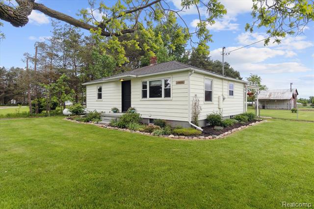 front view picture of 10605 Wilkinson Road, Lennon, MI. 48449
