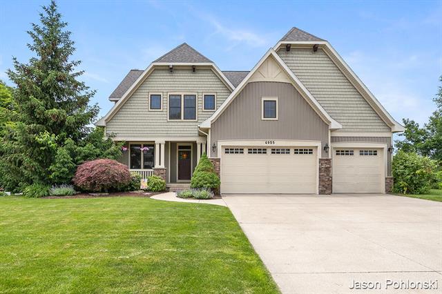 front view picture of 4955 Meadow Springs Trail Se, Ada, MI. 49301