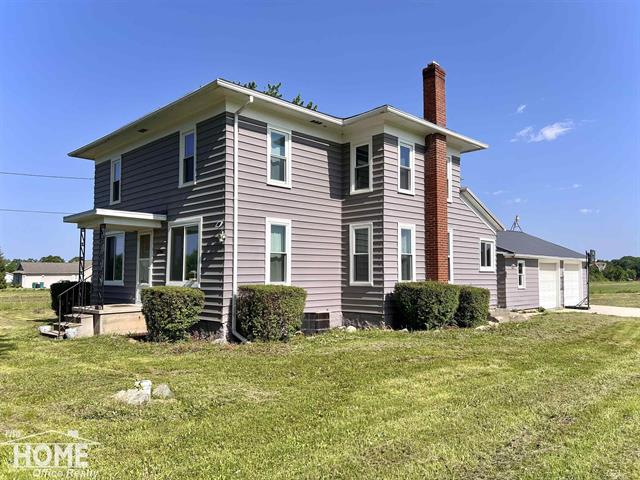 front view picture of 10306 Reid Rd, Swartz Creek, MI. 48473