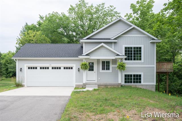 front view picture of 193 E Randall Street, Coopersville, MI. 49404