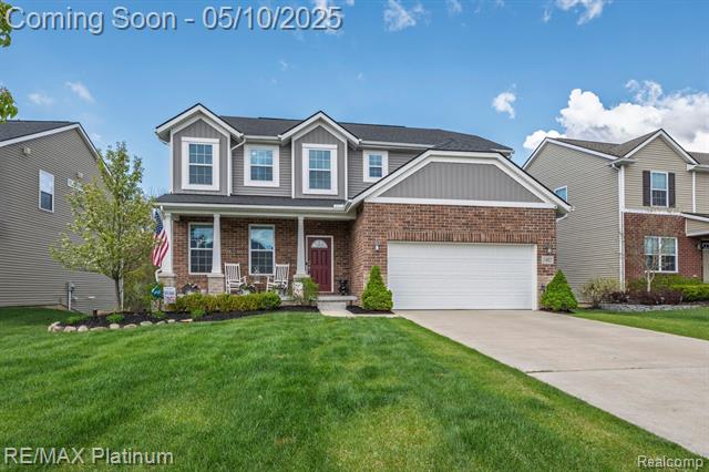 front view picture of 1402 Secretariat Way, Howell, MI. 48843