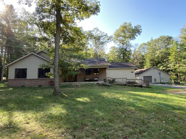 front view picture of 4881 W 7 1/2 Mile Road, Irons, MI. 49644