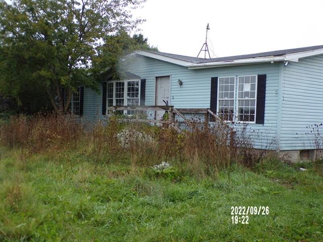 front view picture of 10660 Ellis Road, Belding, MI. 48809