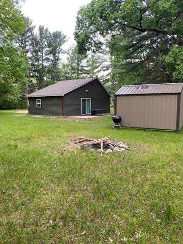 front view picture of 9818 Rapid City Road Nw, Rapid City, MI. 49676