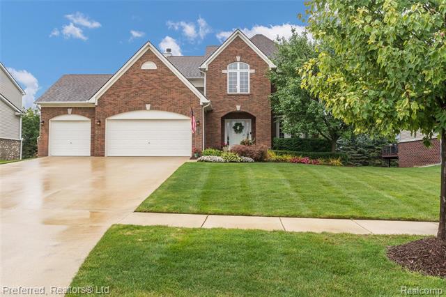 front view picture of 57677 Blossom Valley Trl, New Hudson, MI. 48165