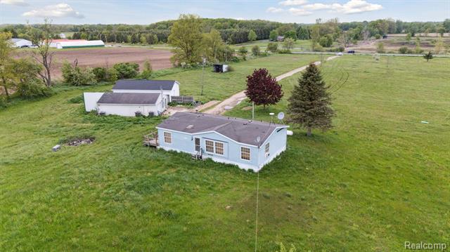front view picture of 1832 E Carson City Road, Sheridan, MI. 48884