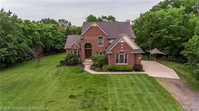 front view picture of 25586 Johns Rd, South Lyon, MI. 48178