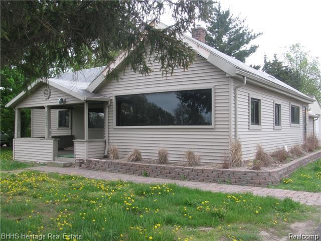 front view picture of 56757 Grand River Ave, New Hudson, MI. 48165