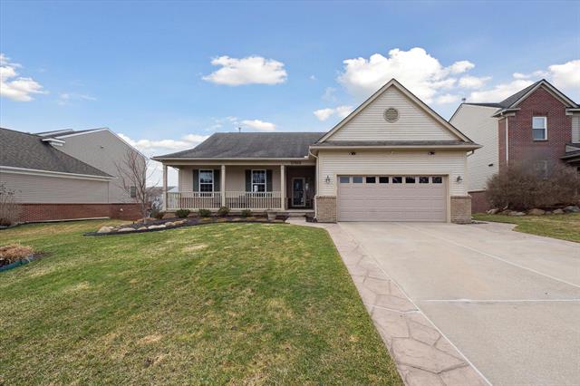 front view picture of 57829 Cider Mill Dr, New Hudson, MI. 48165