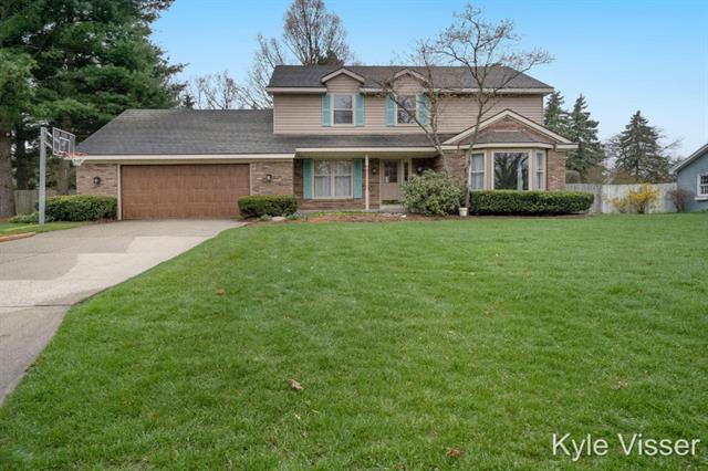 front view picture of 7668 Apple Hill Court Se, Ada, MI. 49301