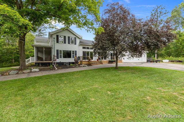 front view picture of 7075 Leonard Road, Coopersville, MI. 49404