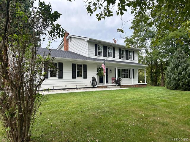 front view picture of 59519 Grand River Ave, New Hudson, MI. 48165