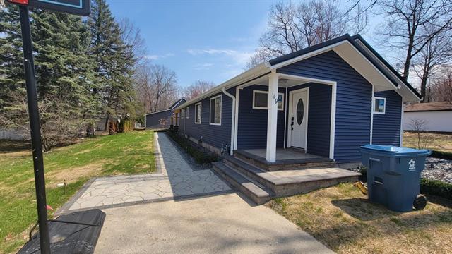front view picture of 119 Desoto Avenue, Houghton Lake, MI. 48629