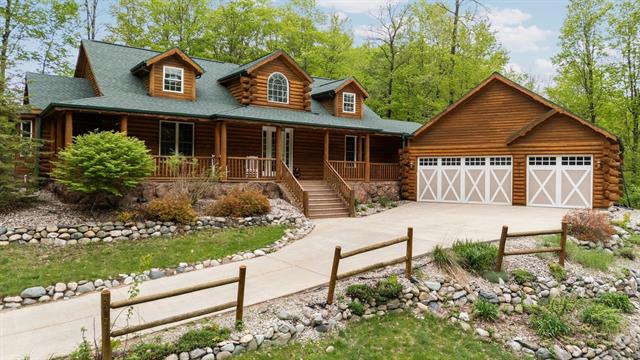 front view picture of 5592 Troon North, Bellaire, MI. 49615
