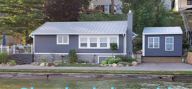 front view picture of 6706 Shoreline Court, Saranac, MI. 48881