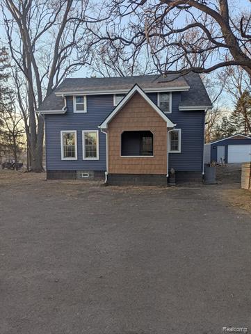 front view picture of 12991 12 Mile Road, South Lyon, MI. 48178