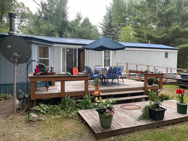 front view picture of 21576 Caberfae Highway, Wellston, MI. 49689