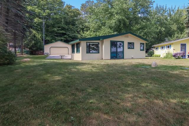 front view picture of 4037 Nw Torch Lake, Kewadin, MI. 49648