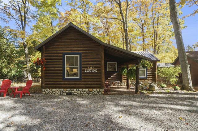 front view picture of 421 S Shabwasung Street, Northport, MI. 49670
