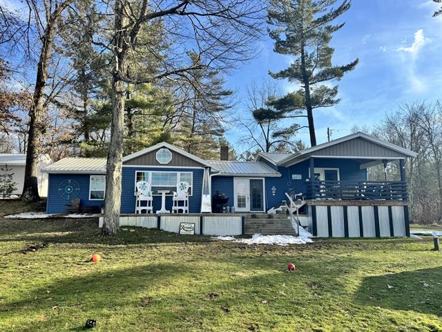 front view picture of 13311 Sandyside Dr Ne, Gowen, MI. 49326