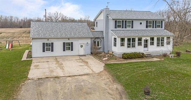 front view picture of 11600 Sargent Road, Fowlerville, MI. 48836