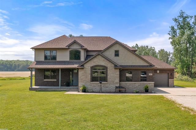 front view picture of 10413 Puttygut Road, Casco, MI. 48064