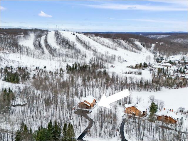 front view picture of 2100 W Schuss Mountain, Bellaire, MI. 49615