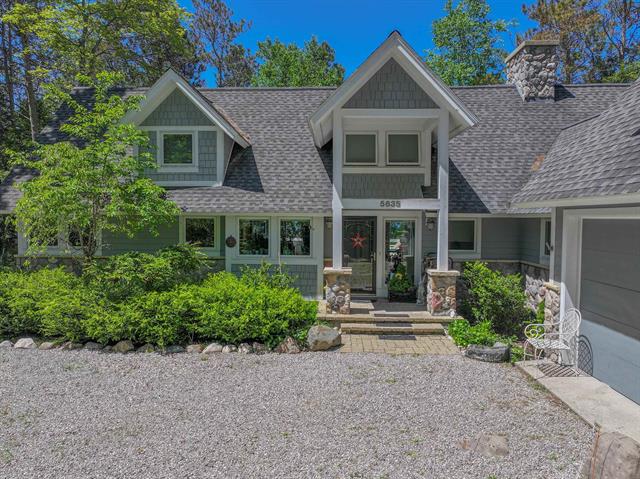 front view picture of 5635 N Leland Woods, Leland, MI. 49654