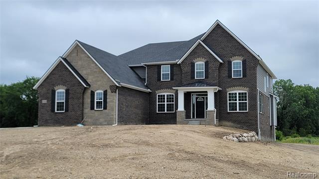 front view picture of 25840 Hickory Creek Lane, New Hudson, MI. 48165