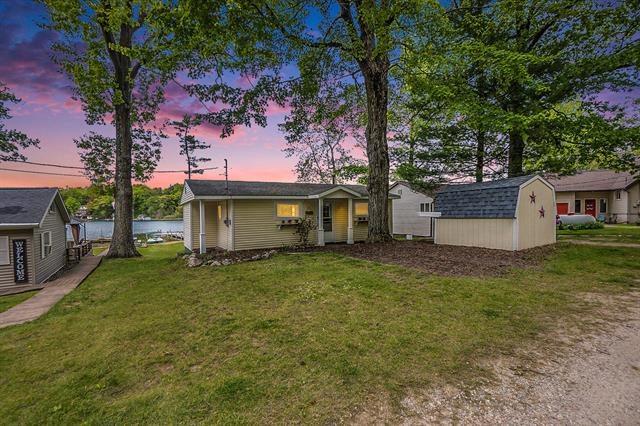 front view picture of 6026 Keeney Drive, Six Lakes, MI. 48886