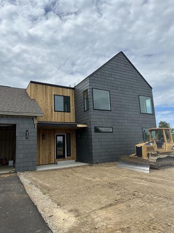 front view picture of 4569 Giles Avenue Ne, Ada, MI. 49301
