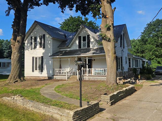 front view picture of 1242 N Rolland Road, Weidman, MI. 48893