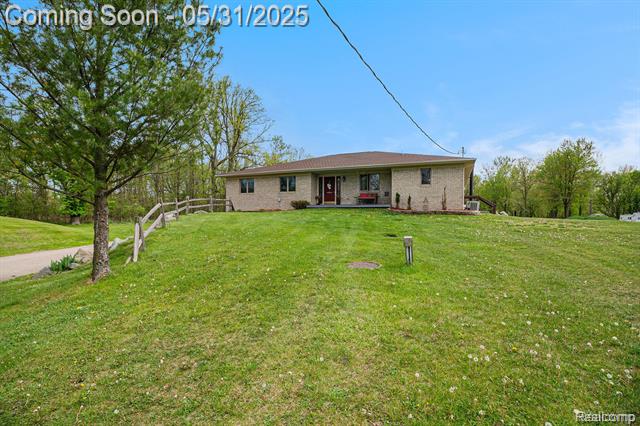 front view picture of 7031 Munsell Road, Howell, MI. 48843