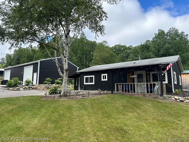 front view picture of 4047 W Higgins Lake Drive, Roscommon, MI. 48653