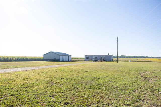 front view picture of 1433 W Peck Lake Road, Ionia, MI. 48846