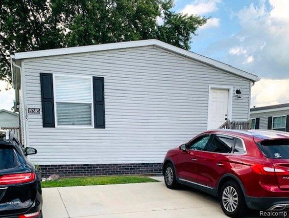 front view picture of 15385 Cartier, Clinton Township, MI. 48038
