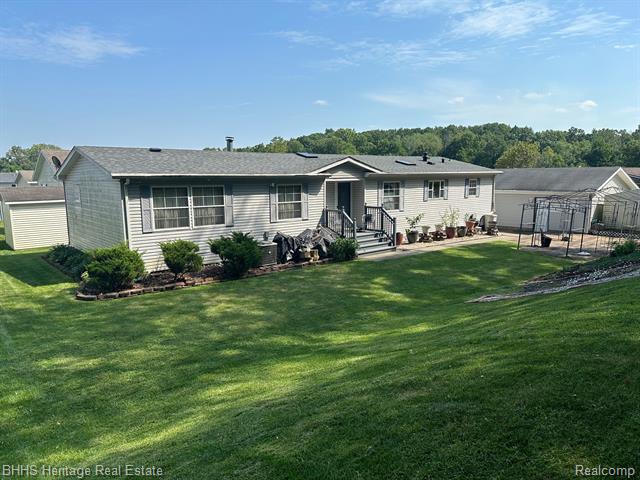 front view picture of 11753 Village Pines Court, South Lyon, MI. 48178