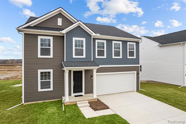 front view picture of 627 Countryside Drive, Chelsea, MI. 48118