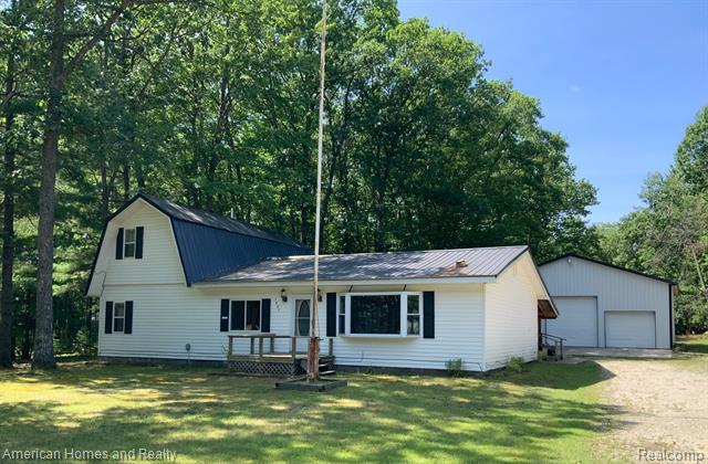 front view picture of 1483 W Bear Lake Road Ne, Kalkaska, MI. 49646
