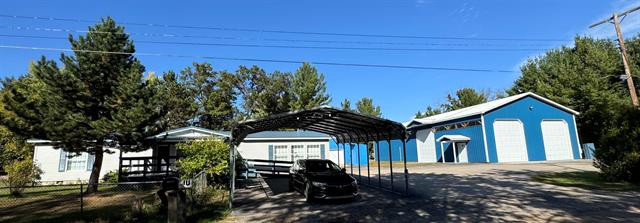 front view picture of 1575 Northwoods Drive, Alger, MI. 48610