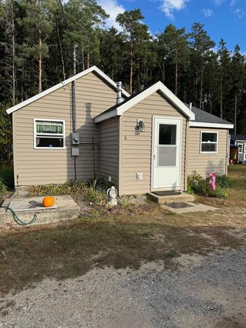 front view picture of 1556 Ne County Road 612, Kalkaska, MI. 49646