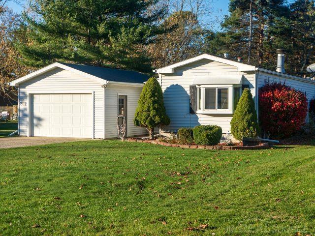 front view picture of 7685 Purdy Drive, Lexington, MI. 48450