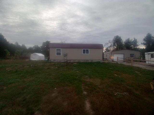 front view picture of 13744 Lakola Road, Leroy, MI. 49655